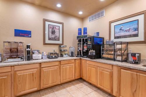 a coffee shop with a counter with coffee machines at Best Western Devils Tower Inn in Hulett