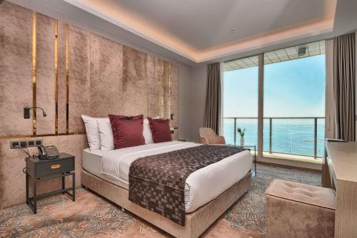 A bed or beds in a room at Best Western Premier Ottoperla Hotel