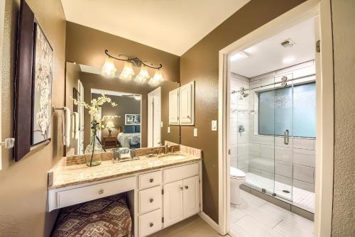 a bathroom with a sink and a toilet and a shower at River Remedy CW C110 in New Braunfels