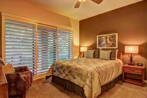 a bedroom with a bed and a large window at River Remedy CW C110 in New Braunfels