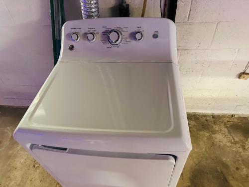 a white stove top oven sitting in a room at Little Elves Overlook in Sparta
