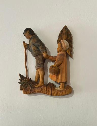 a figurine of two people holding an umbrella at Penzion Pohádka in Třeboň