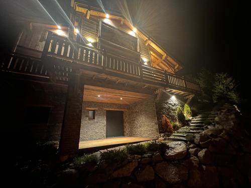 a building with lights on top of it at night at Chalet du rocher Font Romeu in Font Romeu Odeillo Via