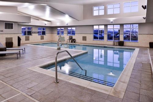 a large swimming pool in a large building at Residence Inn by Marriott Coralville in Coralville