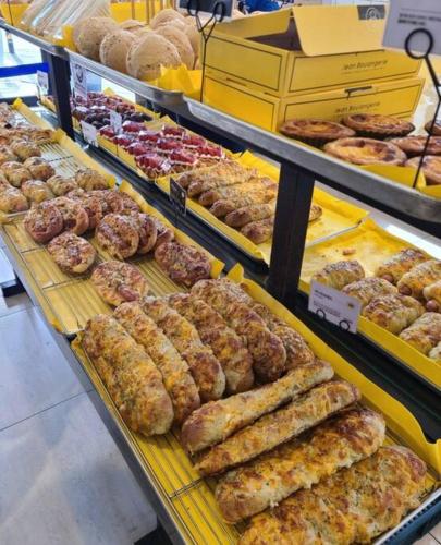 a bakery with many different types of pastries on display at Seoul House in Seoul