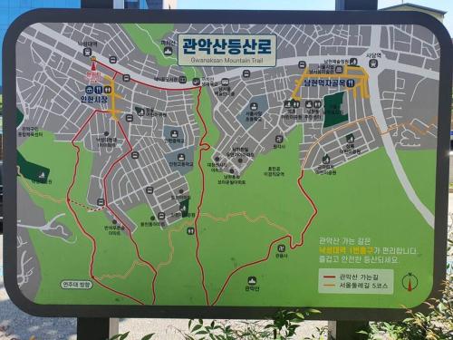 a sign with a map of a park at Seoul House in Seoul