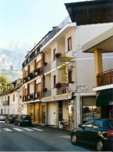 a building with a hotel on the side of a street at Dufour Hotel in Châtillon