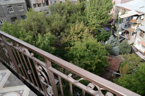 a balcony with a bunch of bushes and trees at Josefin Apartment in Yerevan