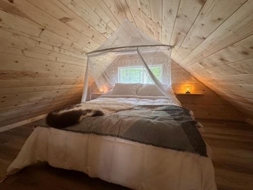 a bedroom with a canopy bed in a attic at Bluestone Acres Farm in Vavenby