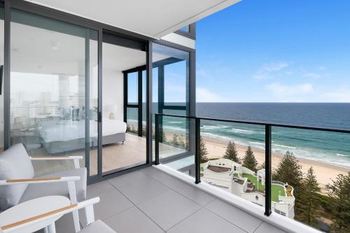 a room with a view of the beach and the ocean at Sandbar Burleigh - Official in Gold Coast