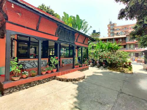 a building with potted plants on the side of it at Lake View Resort in Pokhara