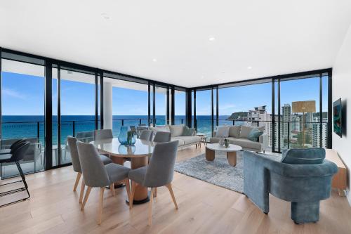 a living room with a view of the ocean at Sandbar Burleigh - Official in Gold Coast