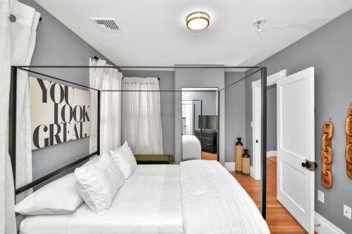 a bedroom with a white bed with a glass frame at Comfort Stay in Boston