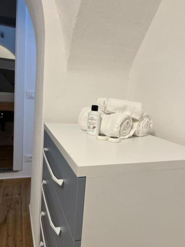 a white kitchen with towels on a counter at La conchiglia in Ceriale