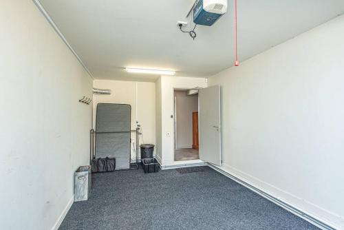 an empty room with a tv on the wall at Hipango Point in Whanganui