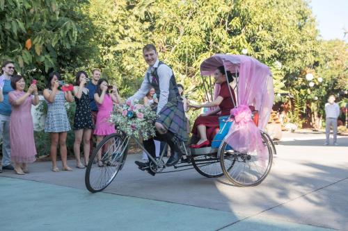 a bride and groom riding on a bike with at Oriental Siam Resort - SHA Extra Plus Certified in Chiang Mai
