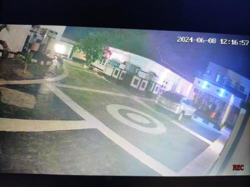 a picture of a street with a stop sign at Kays Apartment in Okpanam