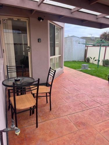a patio with a table and chairs on a patio at Cairnlea Anna's Unit in Deer Park