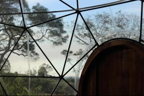 a view of a glass building with a window at Noosa Earth Element Dome - Breathtaking Views in Cootharaba