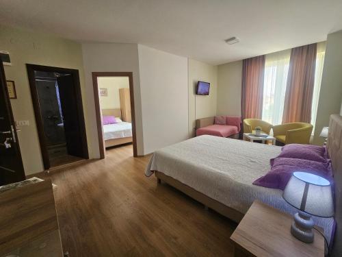 Postel nebo postele na pokoji v ubytování Apartments LOTUS