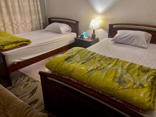 Voodi või voodid majutusasutuse Chalet in Bluebay Asia Resort Ain Sokhna toas