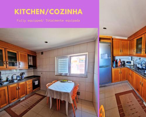 a kitchen with wooden cabinets and a small table with a table at Casa do Tâmega in Chaves