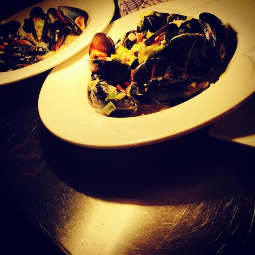 two plates of food sitting on a table at The Beeches Hotel & Leisure Club in Nottingham