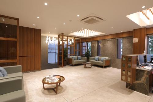 Zona de estar de Plenteous Inn