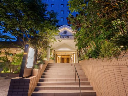 a set of stairs leading to a building at Sunhotel Fukuyama in Fukuyama