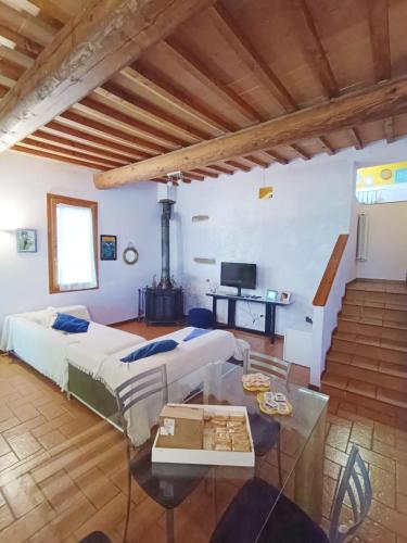 a large room with two beds and a table at Casa Gelso in Scandicci