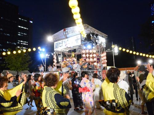 a group of people standing in front of a performance at APA Hotel Sapporo Susukino Ekimae in Sapporo