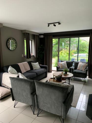 a living room with a couch and a table at Durbuy Dream in Durbuy