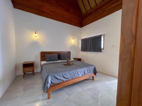 Ein Bett oder Betten in einem Zimmer der Unterkunft Bae Gili Inn