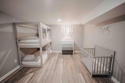 a baby room with two bunk beds and a crib at Hot Tub, Pool table, Sleeps 10 in Lexington