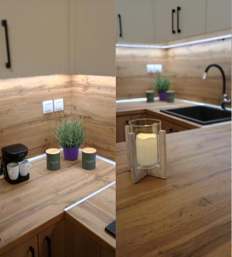 a kitchen with a sink and a counter with a candle at Ioannis Villa in Nea Fokea