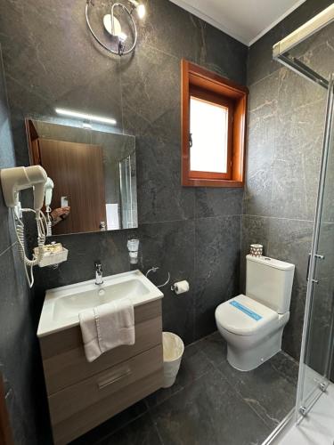Koupelna v ubytování Hotel Moreri