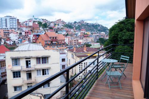 a balcony with a view of a city at La Varangue in Antananarivo