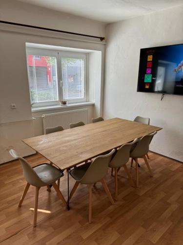 a conference room with a wooden table and chairs at Mikulovská chalupa in Mikulov