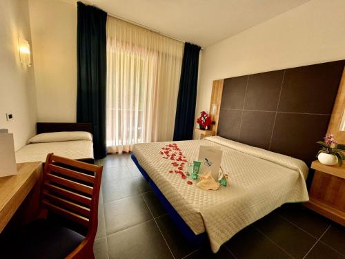 Postel nebo postele na pokoji v ubytování Hotel Fontalleccio