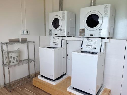 a room with four microwaves on top of machines at Golden Sun Beach Hotel - Vacation STAY 55432v in Igei