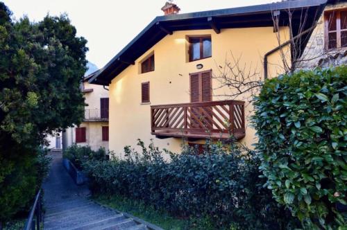 a building with a balcony on the side of it at Casa Caterina - Riva di Solto - Iseo Lake in Riva di Solto