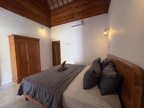 Ein Bett oder Betten in einem Zimmer der Unterkunft Bae Gili Inn