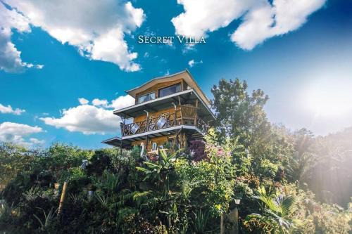 a tree house on top of a hill at Secret Villa Kudat in Kumbatang