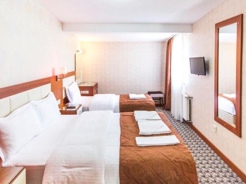 Postel nebo postele na pokoji v ubytování Mint Residence Taksim