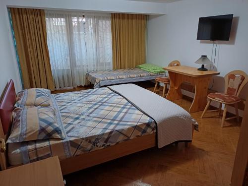 Llit o llits en una habitació de Vila Boss
