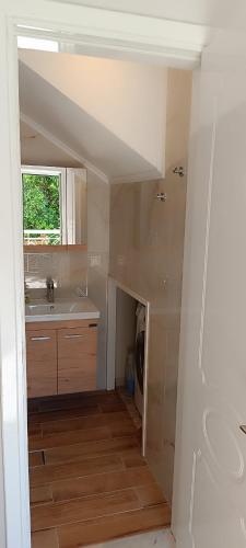 a bathroom with a sink and a shower in it at Villa Pandesia in Afitos