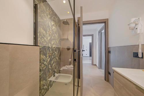 Bagno di ApartmentsGarda - Residenza Garda Deluxe