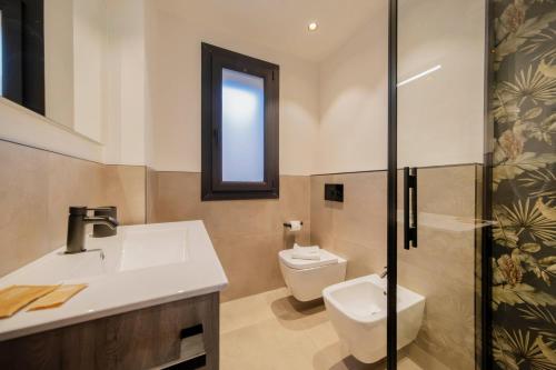 Bagno di ApartmentsGarda - Residenza Garda Deluxe