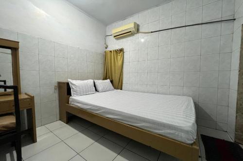 Ένα ή περισσότερα κρεβάτια σε δωμάτιο στο Hotel O Kost Stan