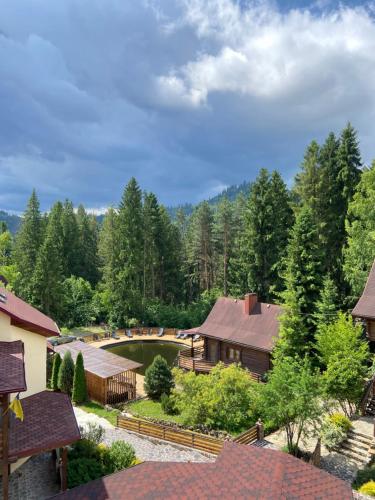 an aerial view of a house with a golf course at Complex Hyzhky in Yaremche